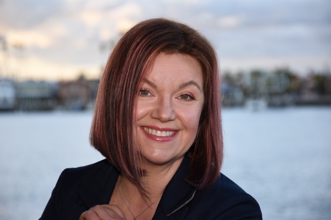 Kat Janowicz on the Long Beach waterfront at dusk