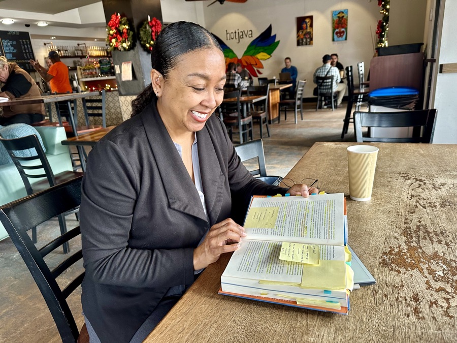 Dana Goland reading Chasing Zero, the pages tabbed and highlighted